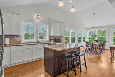 Large eat-in kitchen with a sunlit dining area