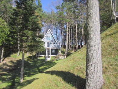 View of Cottage from bluff to Beach