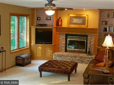 Family room with a wood burning fireplace