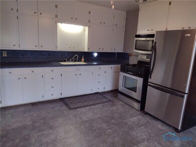 Spacious eat-in kitchen with lots of storage. All
