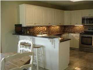 Main Floor kitchen with granite countertops and ea