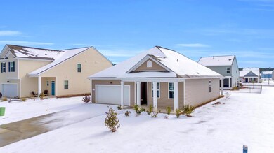 View of front of property featuring a garage