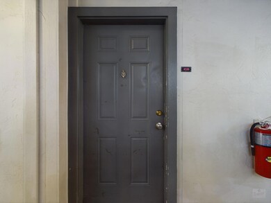 Entrance to property with stucco siding