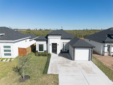 Modern home featuring a garage and a front yard