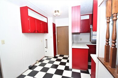 Laundry area off of kitchen, you can cook and do l