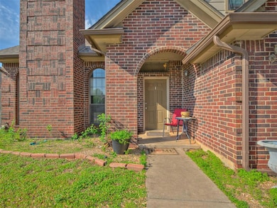 Property entrance with brick siding