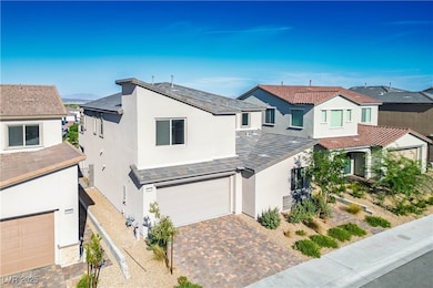 View of front of home with stucco siding, a garage