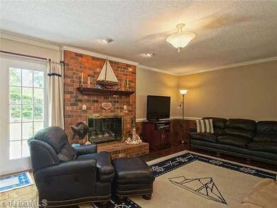 Den/Family/Great Room. A cozy but spacious den for the family to gather.  The fireplace is gas and the floors are wood parquet.