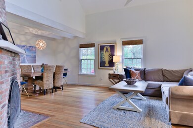 Open living and dining room with fireplace