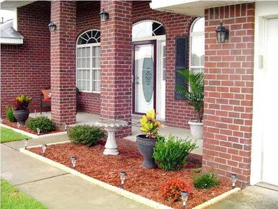 Covered Front Porch with Large Brick Columns