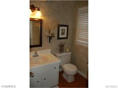 Powder Room with faux finish paint, wood floors