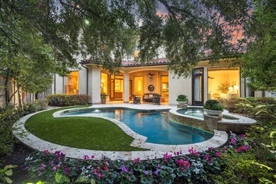 This stunning backyard oasis
features a glistenin