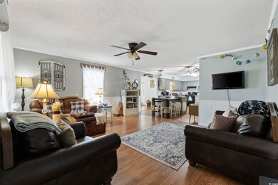 Living room with hardwood / wood-style floors, sin