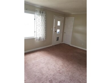 Living room with coat closet and freshly shampooed