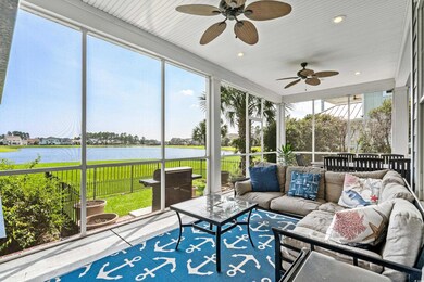 Sunroom / solarium featuring ceiling fan and a wat