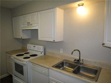 Kitchen with white appliances, under cabinet rang