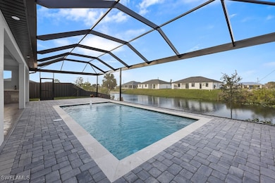 Pool featuring a lanai, fence, a patio area, and a