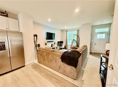 Living room featuring recessed lighting and light