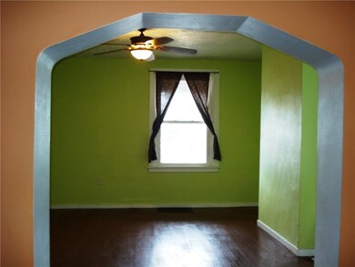 Hardwood flooring, natural light, ceiling fan.