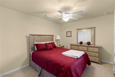 Bedroom featuring light colored carpet, visible ve