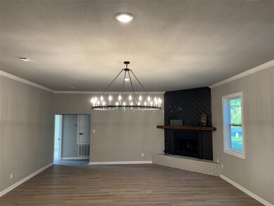 Unfurnished living room with wood-type flooring, a