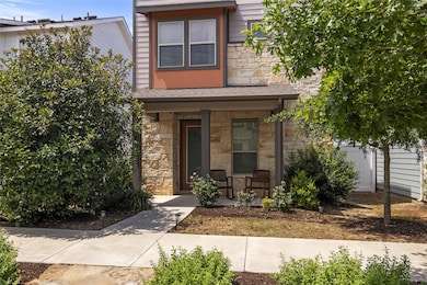 Multi unit property with stone siding and covered