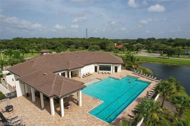 View of pool featuring a water view and a patio ar