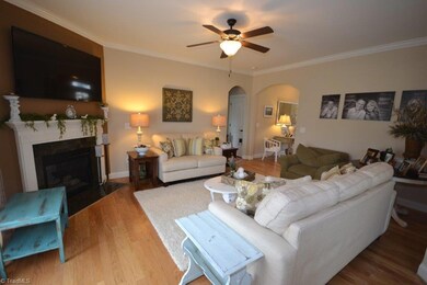 Great Room - Hardwood Floors, Fireplace with Gas Logs, Arched Doorways