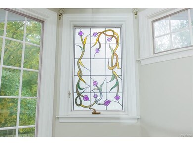 Foyer landing with stained glass windows