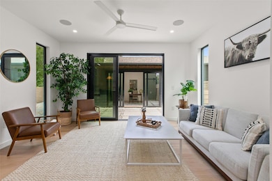 Living area with light wood-style floors, ceiling