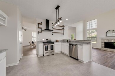 Kitchen with appliances with stainless steel finis