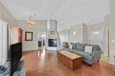 Living room featuring light wood-style flooring, a