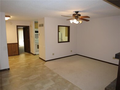Living room opening to eat in area of kitchen.