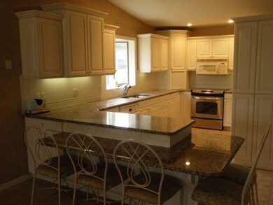 View of kitchen with breakfast bar