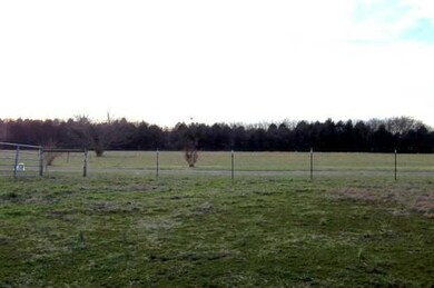 Great views surround this spacious home. Large hayfield.