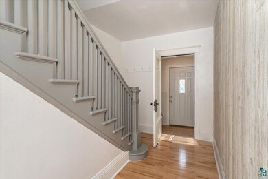 Entryway with light hardwood / wood-style floors