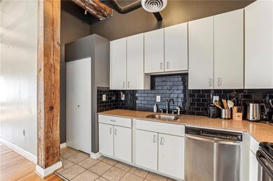 Kitchen with a sink, stainless steel dishwasher, b