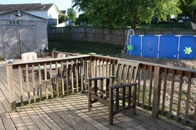Deck overlooks spacious back yard, which continues to the right of the pool .Couldn't get the whole back yard in one picture-see Virtual Tour. Shed has power & air. Brand new above-ground pool.