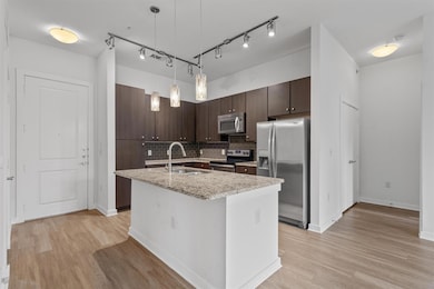 Kitchen featuring appliances with stainless steel