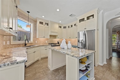 Boasting chic cabinets to the ceiling, there is an