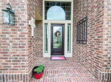 The bricked front porch welcomes you to this lovely home.