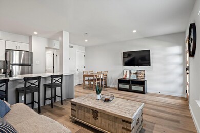 Living room featuring light wood-type flooring, b