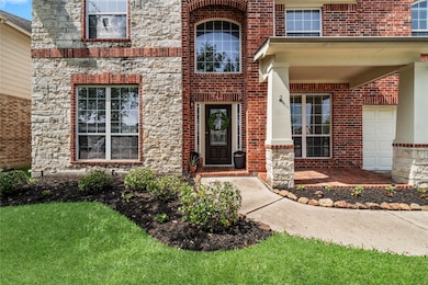 Stunning entryway featuring a charming spacious co