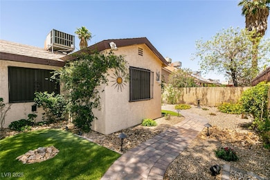 View of side of home with stucco siding and centra