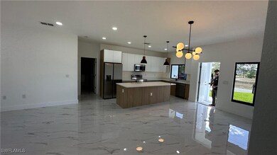 Kitchen featuring stainless steel appliances, marb