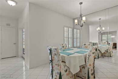 Dining area with light tile patterned floors, a he