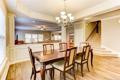 Formal Dining Room with Molded Columns Open to Fam