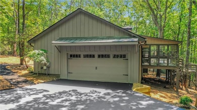 Good view of the enclosed rear porch and two-tiered sun deck