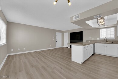 Kitchen with open floor plan, a peninsula, light w