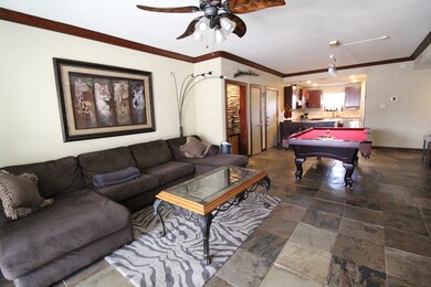 Large versatile space with slate tile and wood bur